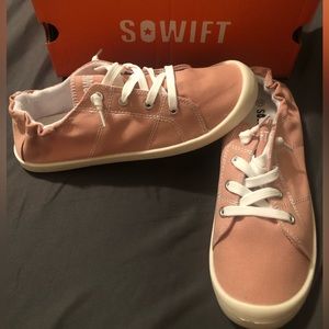 Pink Sowift slide on sneakers. Great for a casual outing.